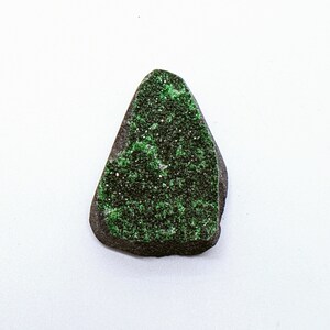 Natural Uvarovite (Green Garnet) cabochon with crystals on top from the Urals, Russia.