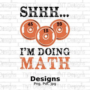May include: A graphic design with the text "SHHH... I'M DOING MATH" in black and orange. Above the text are three orange weight plates with the numbers 45, 15, and 20. The background is a white brick wall.