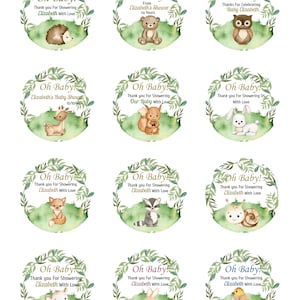 May include: Set of 10 round favor tags with a watercolor woodland theme. Each tag features a different animal, including a hedgehog, bear, owl, deer, squirrel, rabbit, fox, raccoon, snail, and bird. The tags are decorated with green leaves and the text "Oh Baby!" and "Thank you for showering Elizabeth with love."