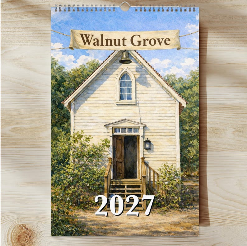 May include: A 2027 wall calendar featuring a watercolor illustration of a light-colored wooden church building with a bell, a single arched window, and an open doorway. A banner at the top displays the text Walnut Grove in brown lettering.