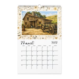 May include: A wall calendar for March 2021 featuring a top illustration of a rustic wooden cabin with a stone chimney and a wooden wagon in the foreground. The calendar page has a grid layout with black text on a white background and floral borders.
