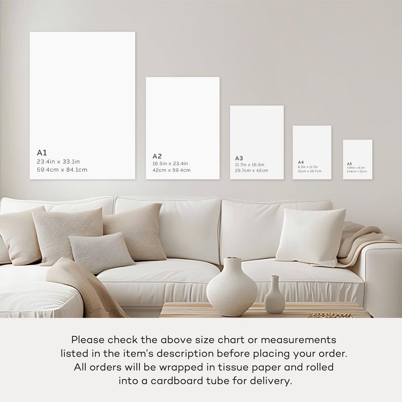 May include: A display of blank art prints in various sizes, including A1 (23.4 x 33.1 inches), A2 (16.5 x 23.4 inches), A3 (11.7 x 16.5 inches), A4, and A5. The prints are displayed above a white sofa with beige pillows and a wooden table.