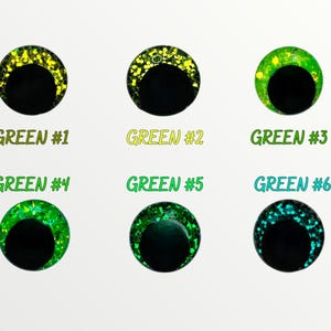 May include: Six round, green, glitter-covered googly eyes with black pupils. The eyes are labeled "GREEN #1" through "GREEN #6".