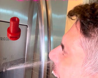 May include: A red plastic fridge water sprayer prank device. The device is positioned near a stainless steel refrigerator, with the text "Fridge Water Sprayer Prank" in a pink and white font.