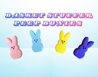 May include: Four colorful Peep bunny candies in pink, blue, yellow, and purple. The image includes the text "BASKET STUFFER PEEP BUNNIES" in a gradient font. These Easter treats are a fun addition to any basket.