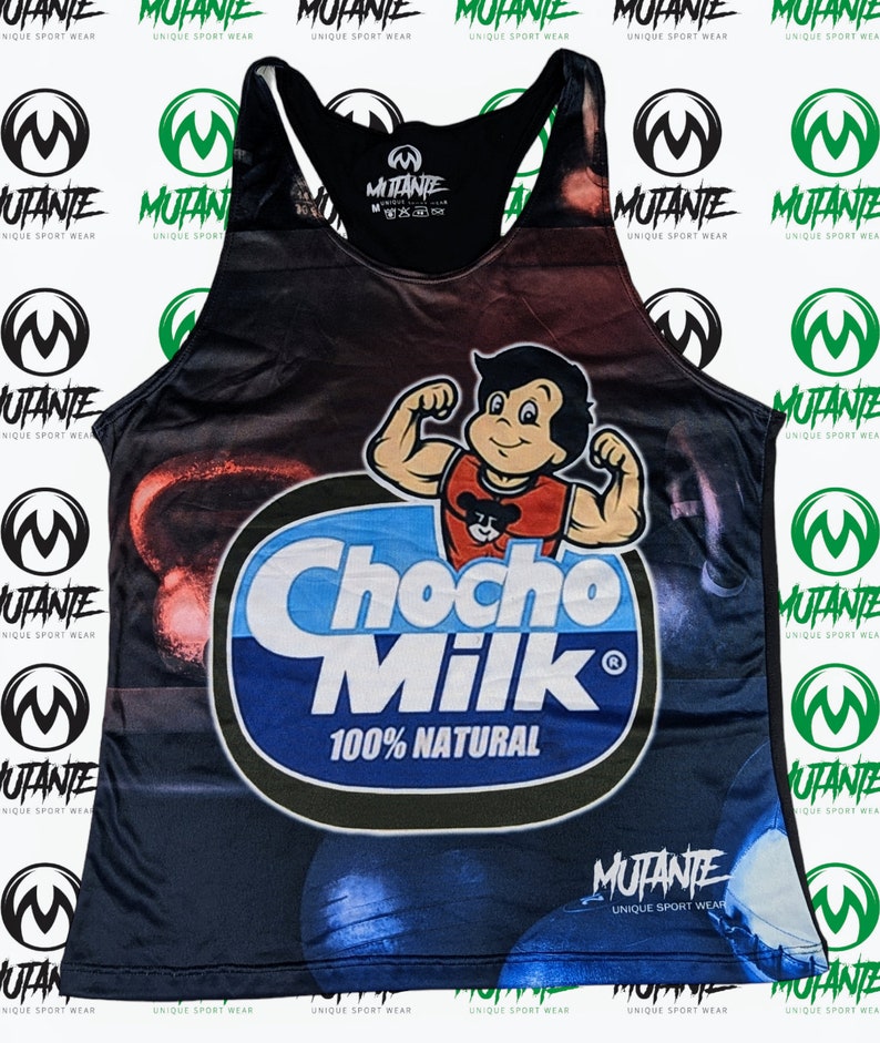 May include: A black tank top with a colorful graphic print of a cartoon character lifting weights and the text "Chocho Milk 100% Natural". The tank top has a black racerback design and the brand name "Mutante Unique Sport Wear" is printed on the bottom.