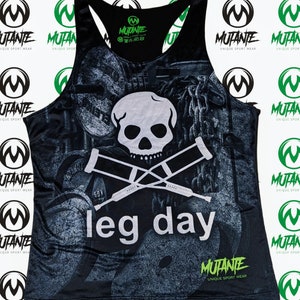 May include: Black tank top with a skull and crossbones graphic and the text "leg day". The tank top has a faded, distressed look and features a green and black "Mutante" logo.