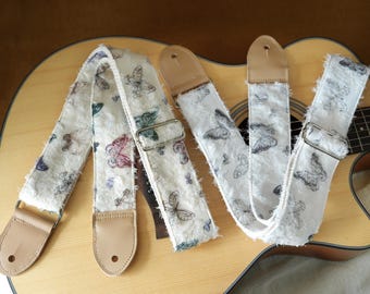 Exquisita correa de guitarra de estilo francés con diseño de mariposa fluida, hecha a mano en algodón y lino con extremos de cuero. Correa universal para guitarra.