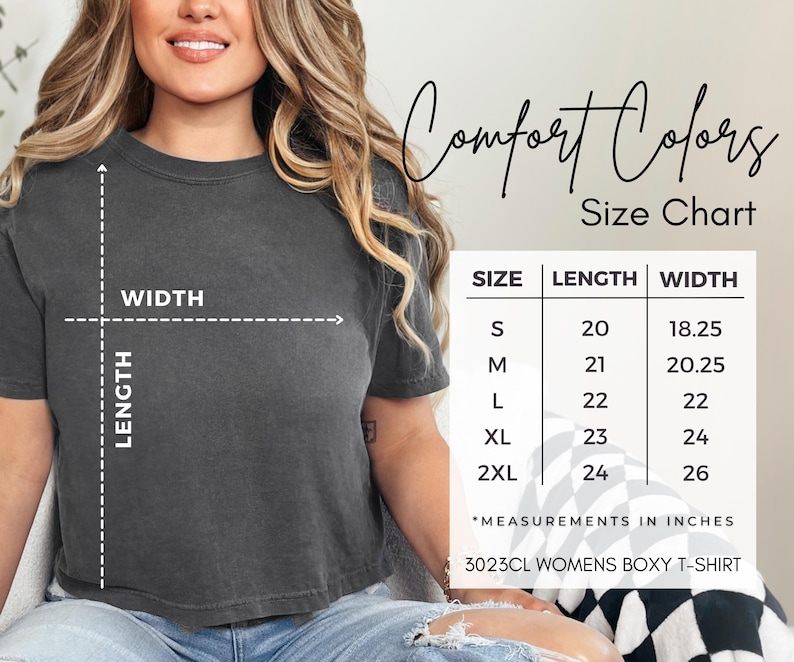 May include: A dark gray boxy t-shirt with a size chart showing measurements in inches. The chart lists sizes S to 2XL, with corresponding length and width measurements. The text "Comfort Colors" and "3023CL WOMENS BOXY T-SHIRT" are also visible.