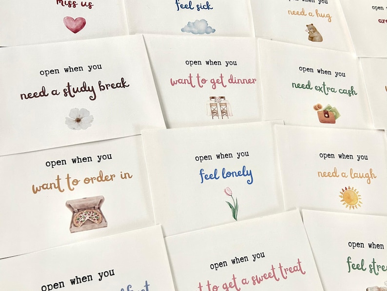 May include: A set of ten cards with different illustrations and phrases. Each card has a different message, such as "open when you need a study break" or "open when you feel lonely".