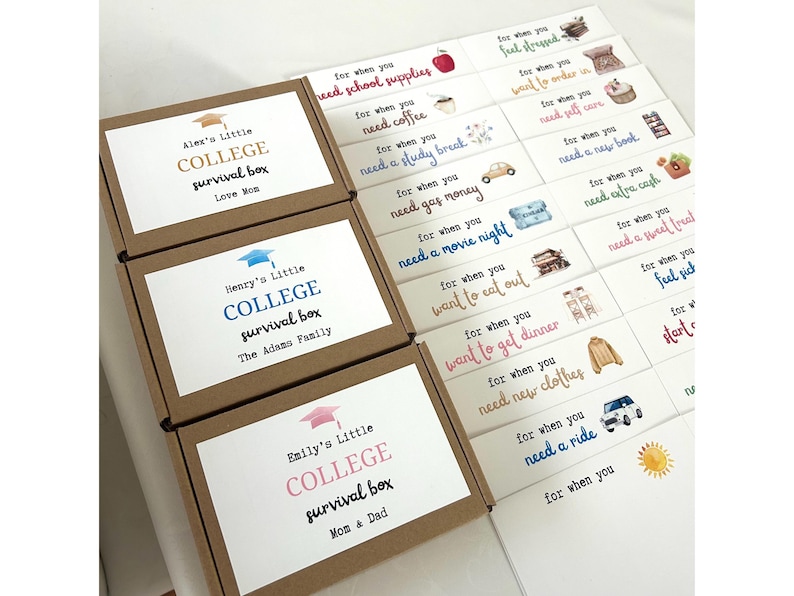May include: Three brown gift boxes with white labels. Each box has a graduation cap and the words "College Survival Box" on the front. The boxes are labeled with different names: Alex's Little, Henry's Little, and Emily's Little. Each box has a personalized message below the name.
