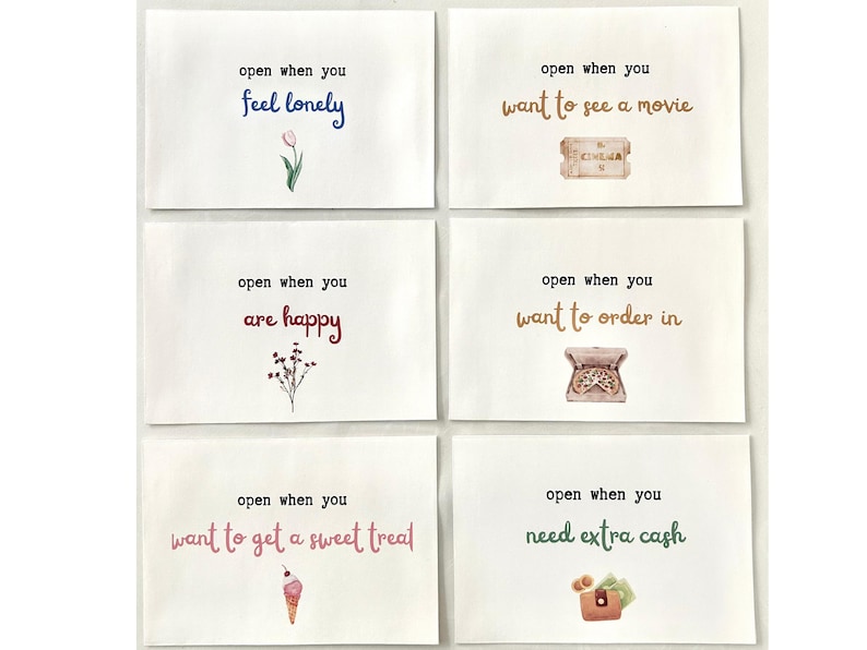 May include: Six white cards with colorful text and illustrations. The cards read: "open when you feel lonely", "open when you want to see a movie", "open when you are happy", "open when you want to get a sweet treat", "open when you want to order in", and "open when you need extra cash".