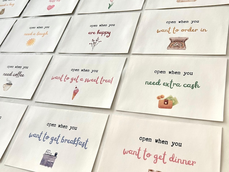 May include: A set of 10 white envelopes with colorful illustrations and text that reads "open when you..."  The text includes phrases like "need a laugh", "are happy", "want to order in", "need coffee", "want to get a sweet treat", "want to get breakfast", "need extra cash", and "want to get dinner".