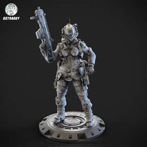 May include: A grey figurine of a futuristic soldier, holding a rifle. The figure is wearing a full combat suit with a helmet and is standing on a circular base. The Extraguy logo is in the upper left corner.