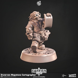 May include: A brown Dwarven Mapstone Cartographer figurine. The figure wears goggles and a coat, holding a scroll. The base is 25 mm. The figurine is part of the Dwarven Legacy collection.