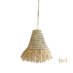 May include: A natural woven pendant light with a fringed bottom. The light is made of a light brown material and has a bell shape.
