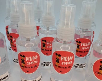 May include: Multiple clear plastic spray bottles with red and white labels that say "Kitty Spray Stay Fresh All Day 30Z All Natural Water-Tea Tree Lavender".
