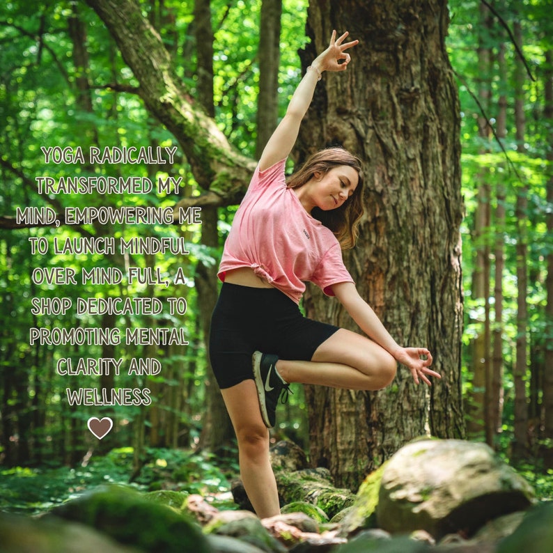 May include: A woman in a pink shirt and black shorts performs a yoga pose in a forest setting. The text "YOGA RADICALLY TRANSFORMED MY MIND, EMPOWERING ME TO LAUNCH MINDFUL OVER MIND FULL, A SHOP DEDICATED TO PROMOTING MENTAL CLARITY AND WELLNESS" is displayed on the image.