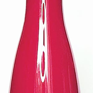 May include: A tall, slender vase with a glossy, vibrant magenta finish. The vase features a smooth, curved silhouette that tapers towards the neck and flares slightly at the base, which is constructed from a clear, thick glass material.