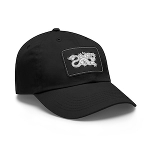 May include: A black baseball cap with a white embroidered dragon patch on the front.
