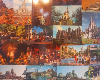 May include: A collage of vintage postcards featuring various scenes from a theme park. The images include castles, fireworks, parades, and other attractions. The postcards are in various colors and depict different areas of the park.