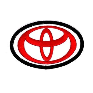 May include: Red and black embroidered Toyota logo patch. The logo is a stylized oval with a red 'T' shape inside.