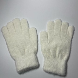 May include: A pair of white fuzzy fingerless gloves. The gloves are made of a soft, fluffy material and have a ribbed cuff.