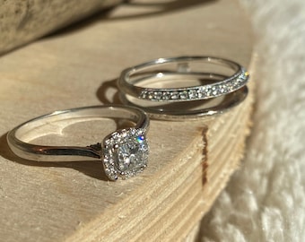 14kt white gold diamond engagement ring and wedding band.