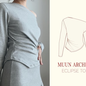 May include: A gray one-shoulder long-sleeve top with a draped design. The top is shown on a model and has the text "MUUN ARCHIVE ECLIPSE TOP" on the right side of the image.