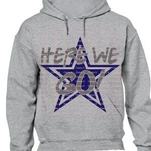 May include: Gray hooded sweatshirt with a blue star design. The star has a white outline and the text "HERE WE GO!" inside.