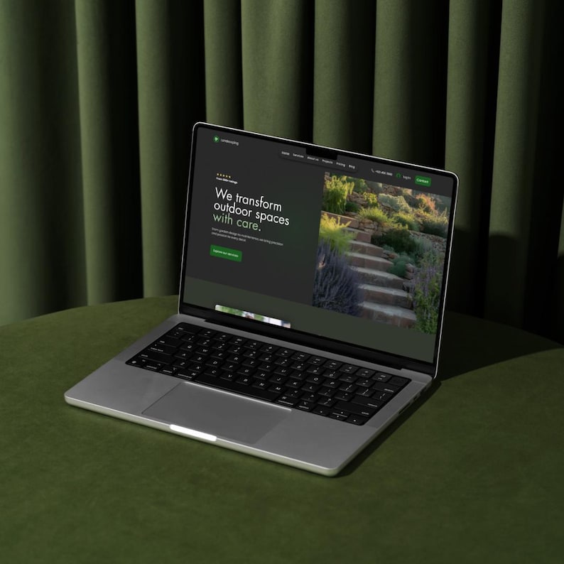 Laptop mockup displaying a landscaping Wix website template on a green table with curtain backdrop.