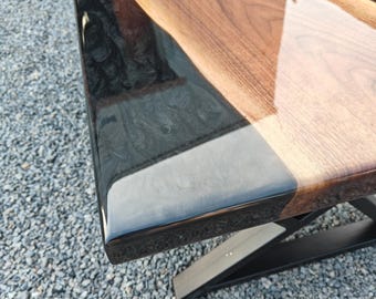 Coffee table of black walnut wood with metallic black swirl epoxy resin
