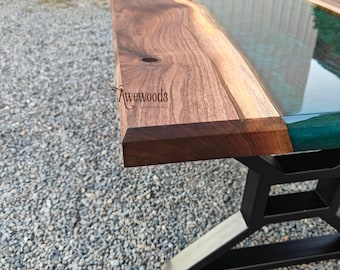 Coffee table of black walnut wood with green swirl epoxy resin