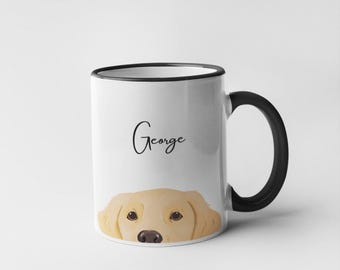 May include: White ceramic mug with a black handle and rim. The mug features a golden retriever illustration at the bottom and the name "George" in a cursive font. The mug is a standard size for coffee or tea.