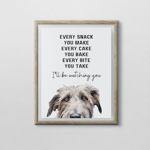 May include: A framed print with a black and white illustration of a dog with the text "Every snack you make, every cake you bake, every bite you take, I'll be watching you."