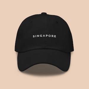 May include: A black baseball cap with white embroidered text that reads "SINGAPORE".