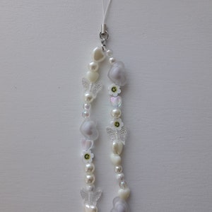 White pearls and clear phone charm