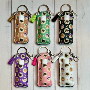 Llavero de tela con forma de bálsamo labial y galletas de Halloween