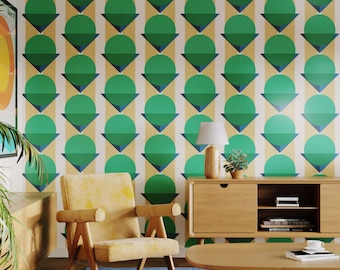 May include: A living room interior with a yellow armchair, a wooden coffee table, a wooden cabinet with shelves, and a lamp on top. The wall is covered with a geometric wallpaper with green and yellow circles and blue triangles.