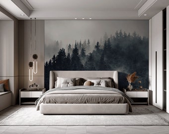 May include: A bedroom with a large bed, two nightstands, and a large window. The wall behind the bed has a mural of a foggy forest. The bed has a white headboard and a gray comforter. The nightstands are white and have lamps on them.