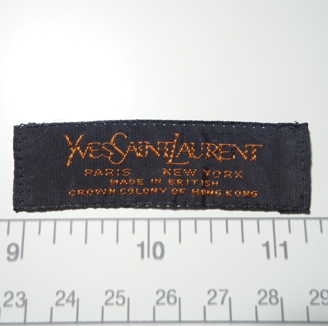 From The Yves Saint Laurent Fabric Boutique'.  Yves saint laurent, Sewing  labels, Label design