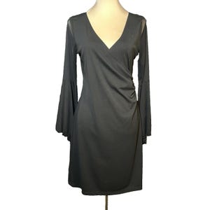 black dress brown jacket Bebe Women's Lace Bell Sleeve Cutout Dress, Size XXS in Black main image 0