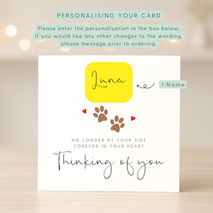 A large white square  lightly textured card, where a name can be added, along with the words 'No longer by your side, forever in your heart, thinking of you'. The card features a paw print and love heart simple illustration. This image shows how to personalise the card, showing highlighted areas and instructions.