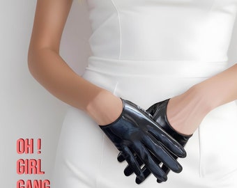 May include: A person wearing a white dress and black leather fingerless gloves. The text "OH! GIRL GANG" is printed on the image.