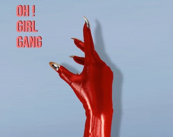 May include: A red hand with long, silver-tipped nails. The hand is raised with the fingers spread out. The text "OH! GIRL GANG" is in the top left corner of the image.