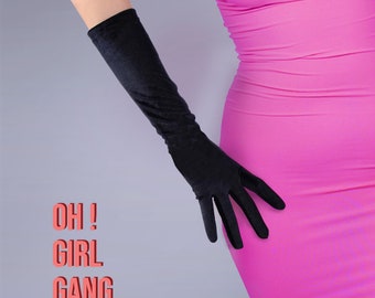 May include: A person wearing a pink dress and long black velvet gloves. The text "OH! GIRL GANG" is printed on a white background.