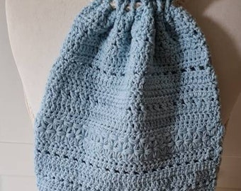 Crocheted pattern mix ladies backpack in light blue