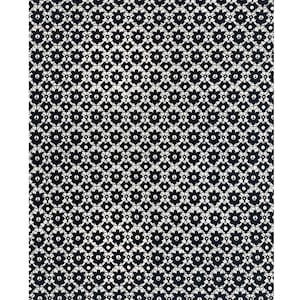 May include: Black lace fabric with a repeating pattern of small flowers. The fabric has a scalloped edge.