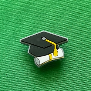 Graduation cap with diploma shoe charm
