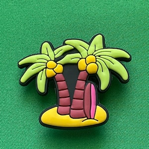 May include: A colorful palm tree charm with a surfboard, perfect for adding a tropical touch to your jewelry or accessories.